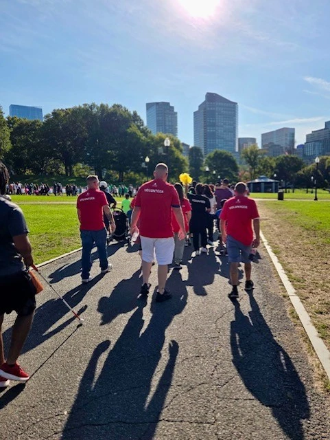 Three Clancy Brothers team members walking in the St. Jude walk line